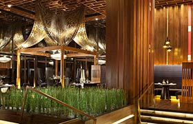 The elegant wooden interior of the Sra Bua by Kiin Kiin restaurant