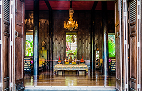 A Buddha altar at the Jim Thompson House