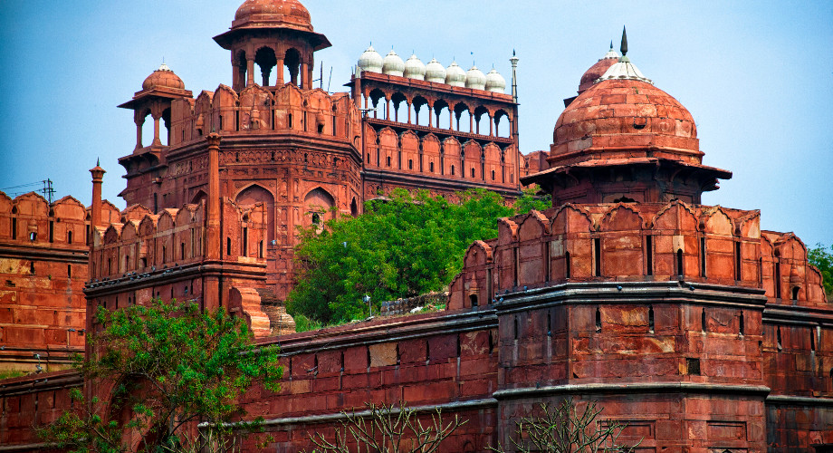 The bright sandstone walls of the Red Fort in Old Delhi, India