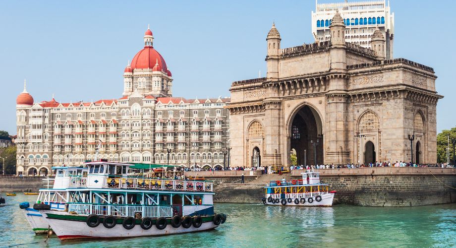 Boat in front of the Gateway of India and Taj Mahal Palace Hotel, Mumbai