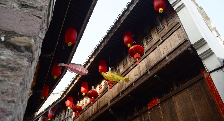Ancient buildings with wooden details and lanterns at Qiantong Ancient Town in Ningbo