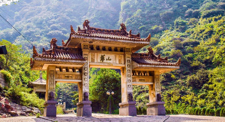 The Huashan Memorial Gateway in Xi’an surrounded by mountain greenery