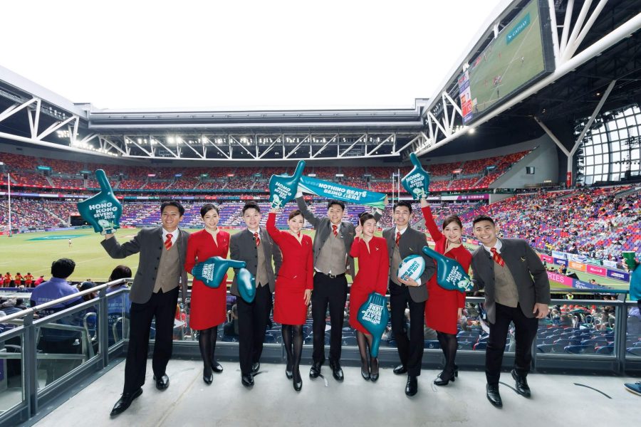 A group of uniform staff in a stadium