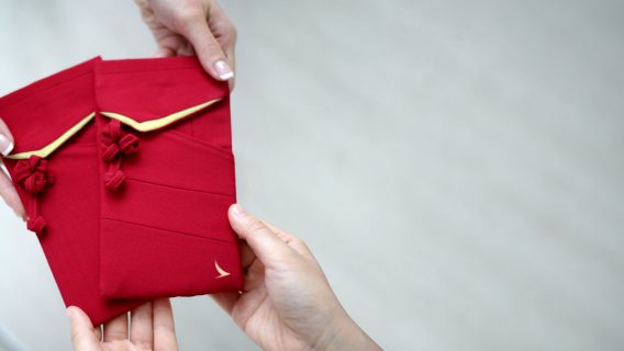 Designers made travel pouches with Cathay uniform features from our old uniforms
