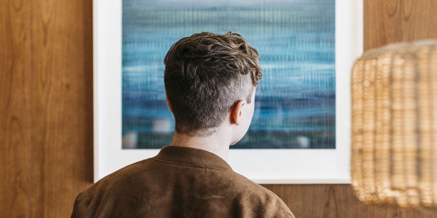 A person looking at an artwork.