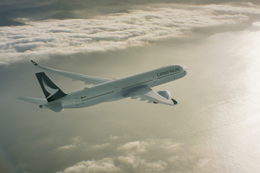 Cathay Pacific plane flying above clouds