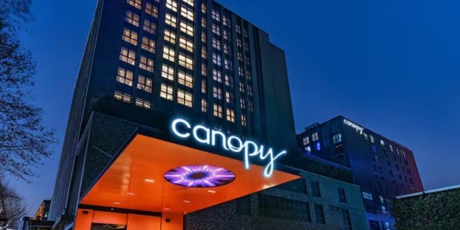 Night view featuring bright lights and contemporary design amidst the urban landscape.