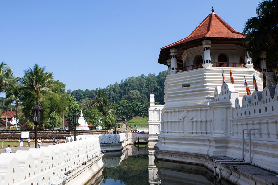 The Temple of the Tooth in Sri Lanka, an iconic Buddhist site, featuring ornate architecture and tranquil gardens.