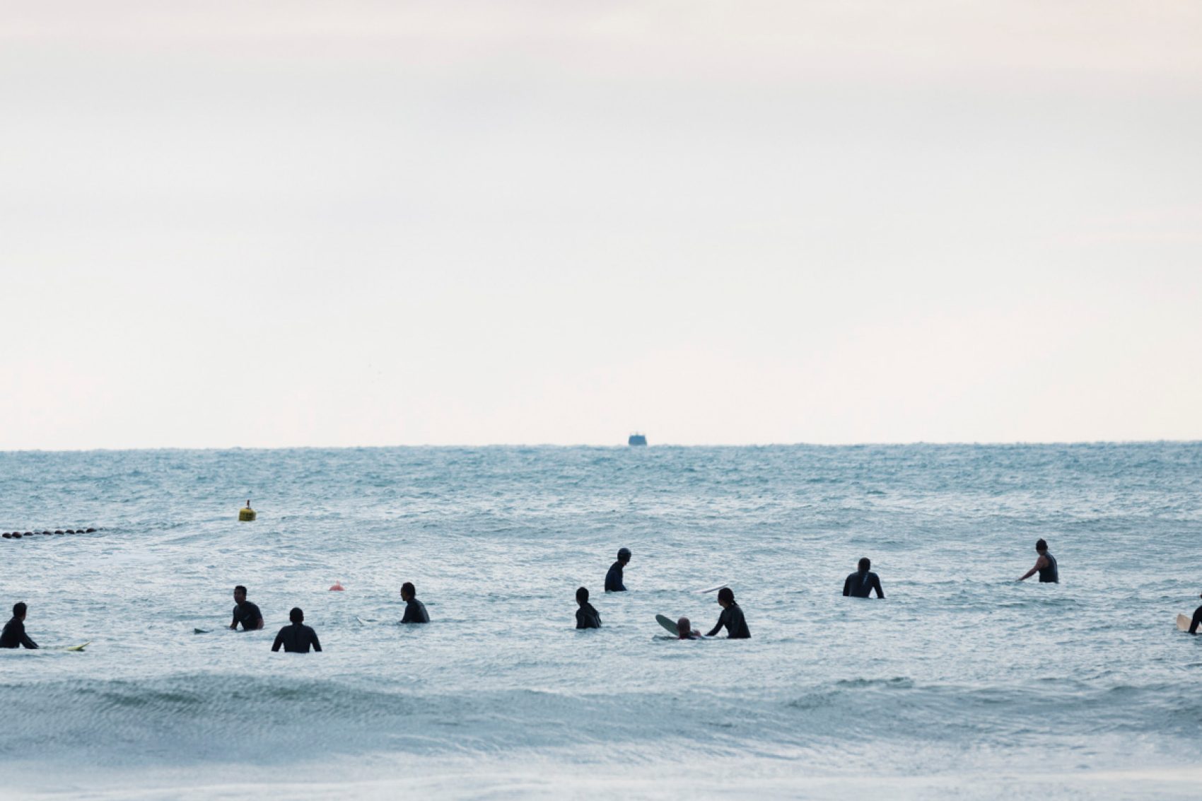 A few of sunrise thrillseekers at the Big Wave Bay, Hong Kong