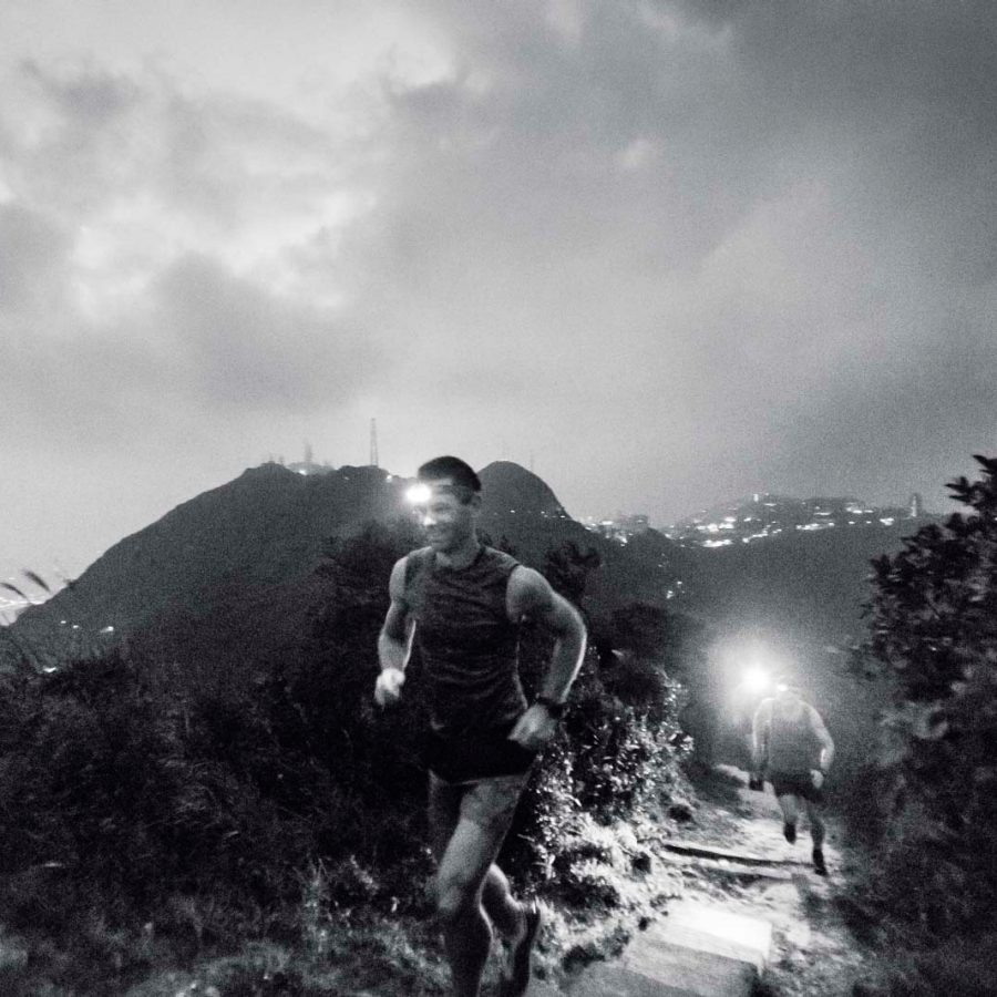 Trail runners go up High West, Hong Kong