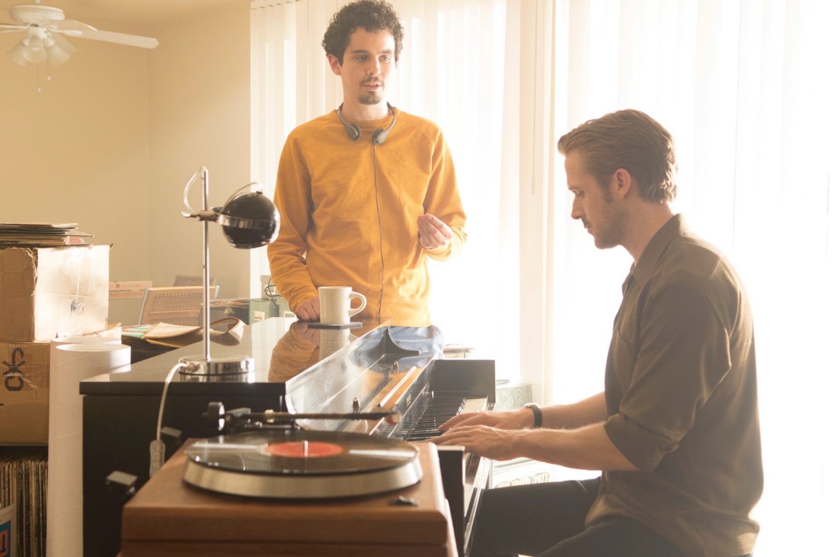 Song and dance man: Damien Chazelle (left), directing Ryan Gosling (right) on the set of La La Land. Credit: Dale Robinette