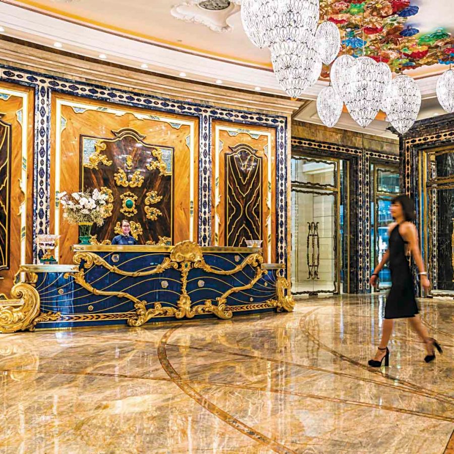 Woman walking through hotel lobby. Credit: Quinn Ryan Mattingly
