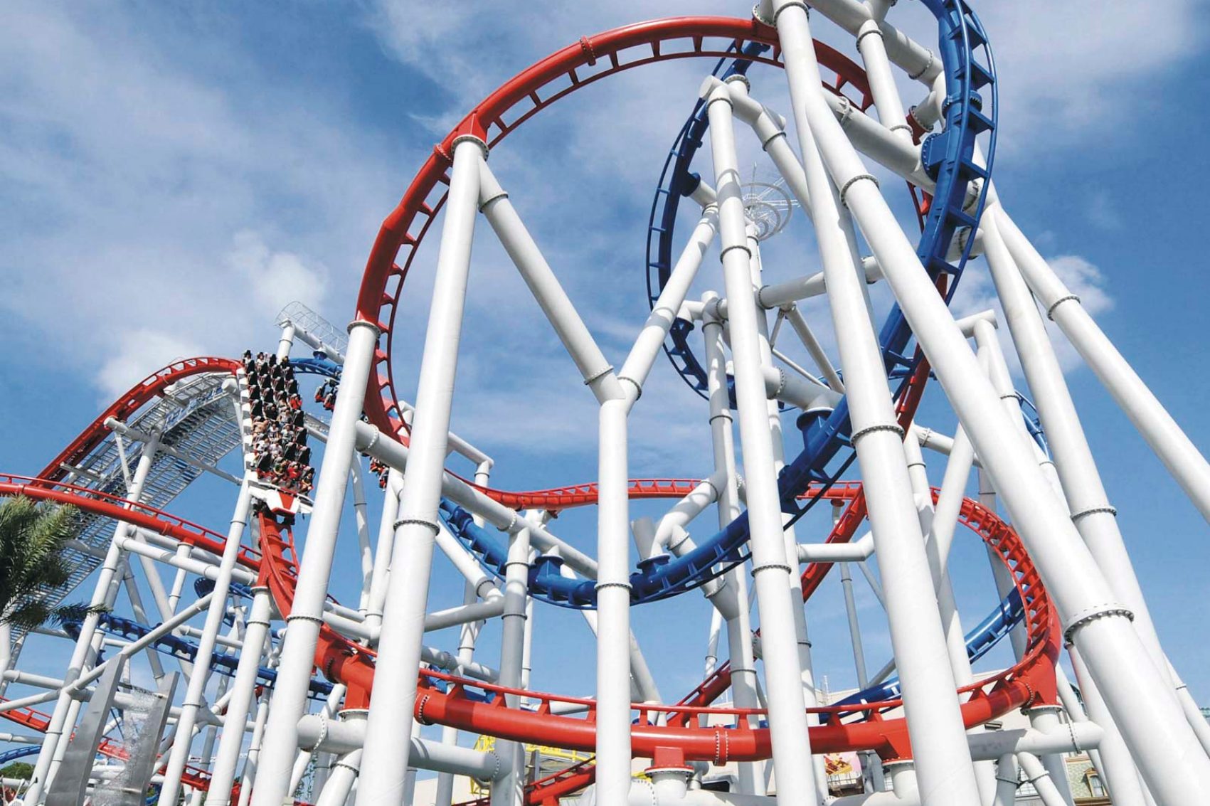 Two rollercoasters on separate tracks, intertwined at the Universal Studios movie theme park in Singapore