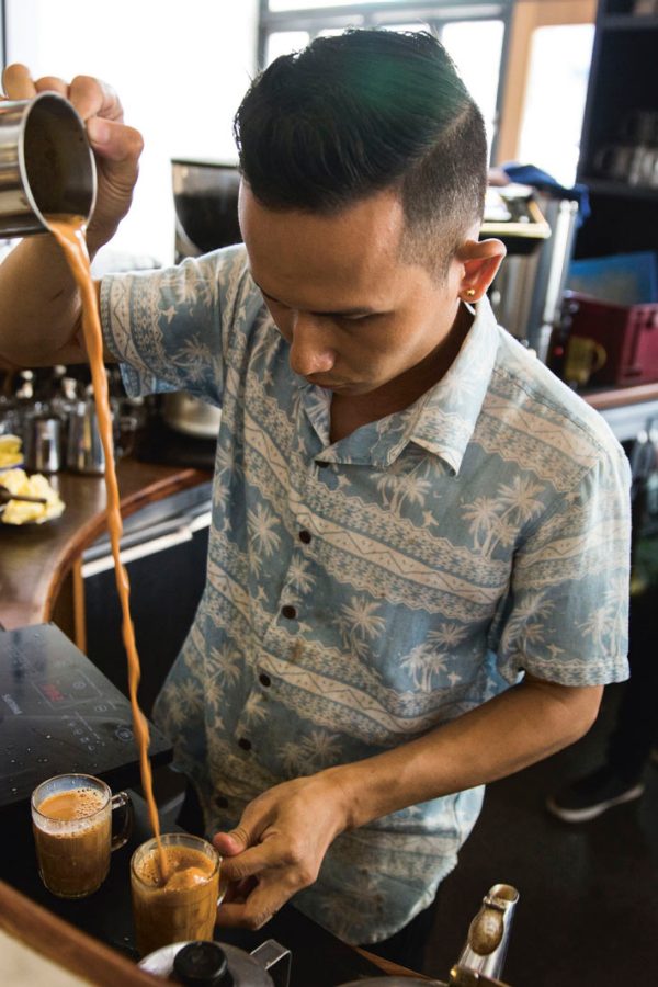 A man makes tea at Rangoon Tea House in Yangon, Myanmar 
