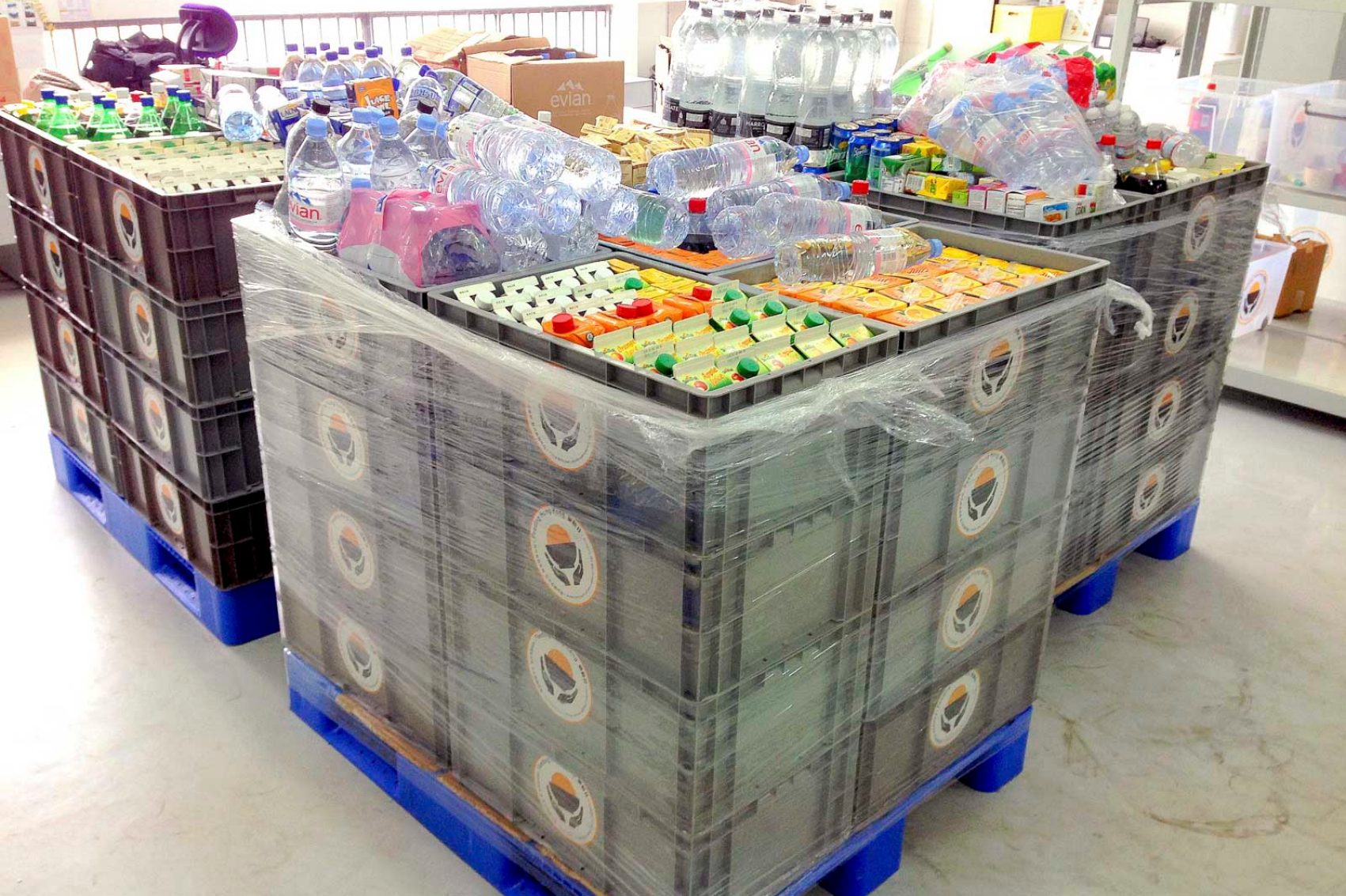 Crates of soft drinks and water ready for delivery