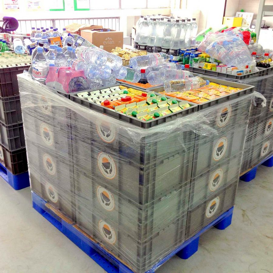 Crates of soft drinks and water ready for delivery