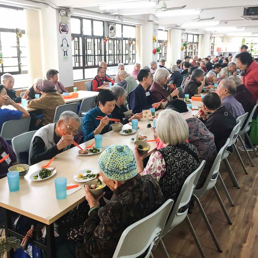 People eating in a dinner hall