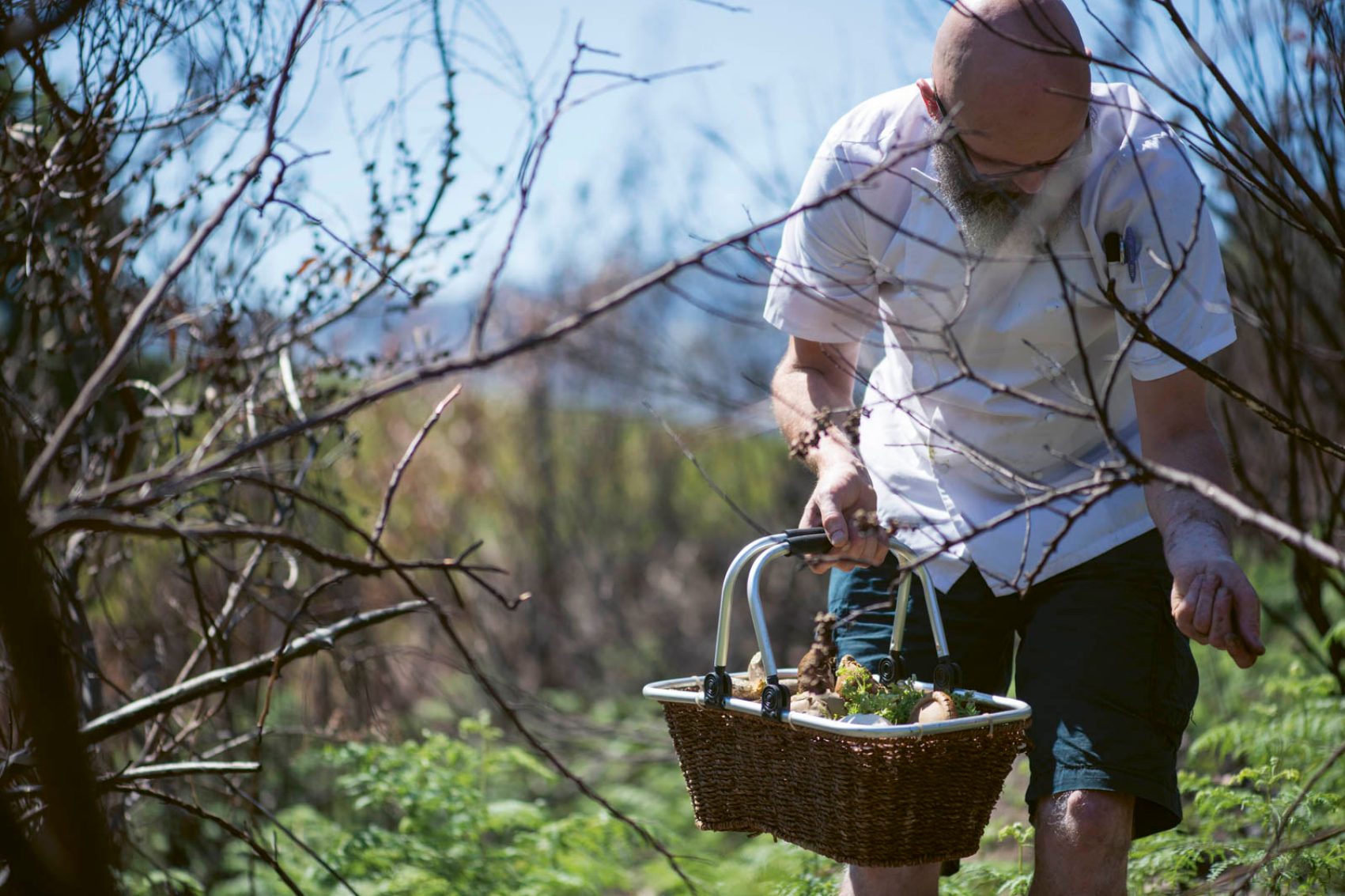 Man holding a basket of food