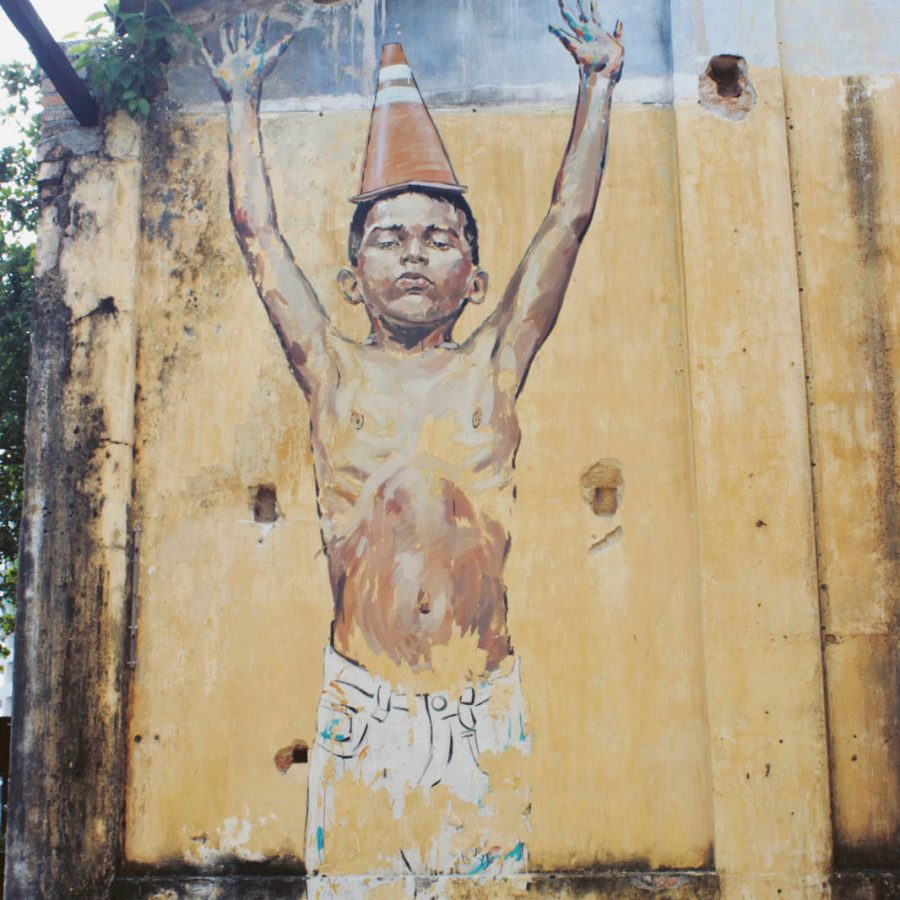 Street painting of a naked boy.