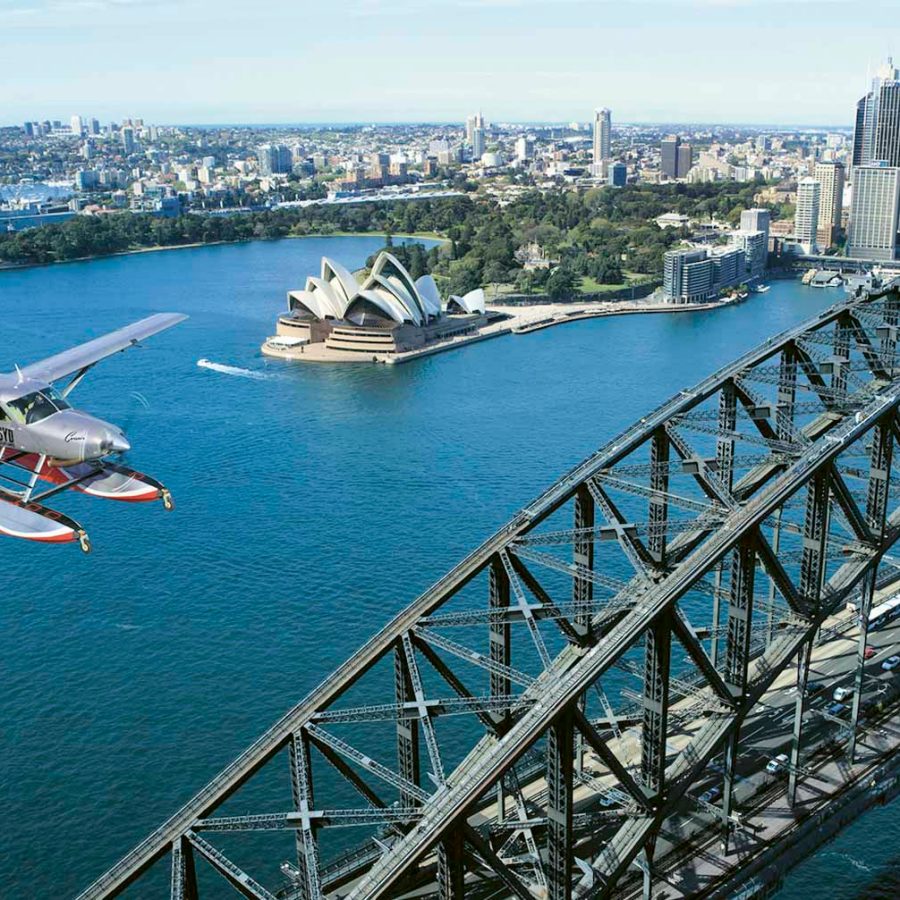 Sydney Seaplane flying over Sydney Harbour and Sydney Opera House