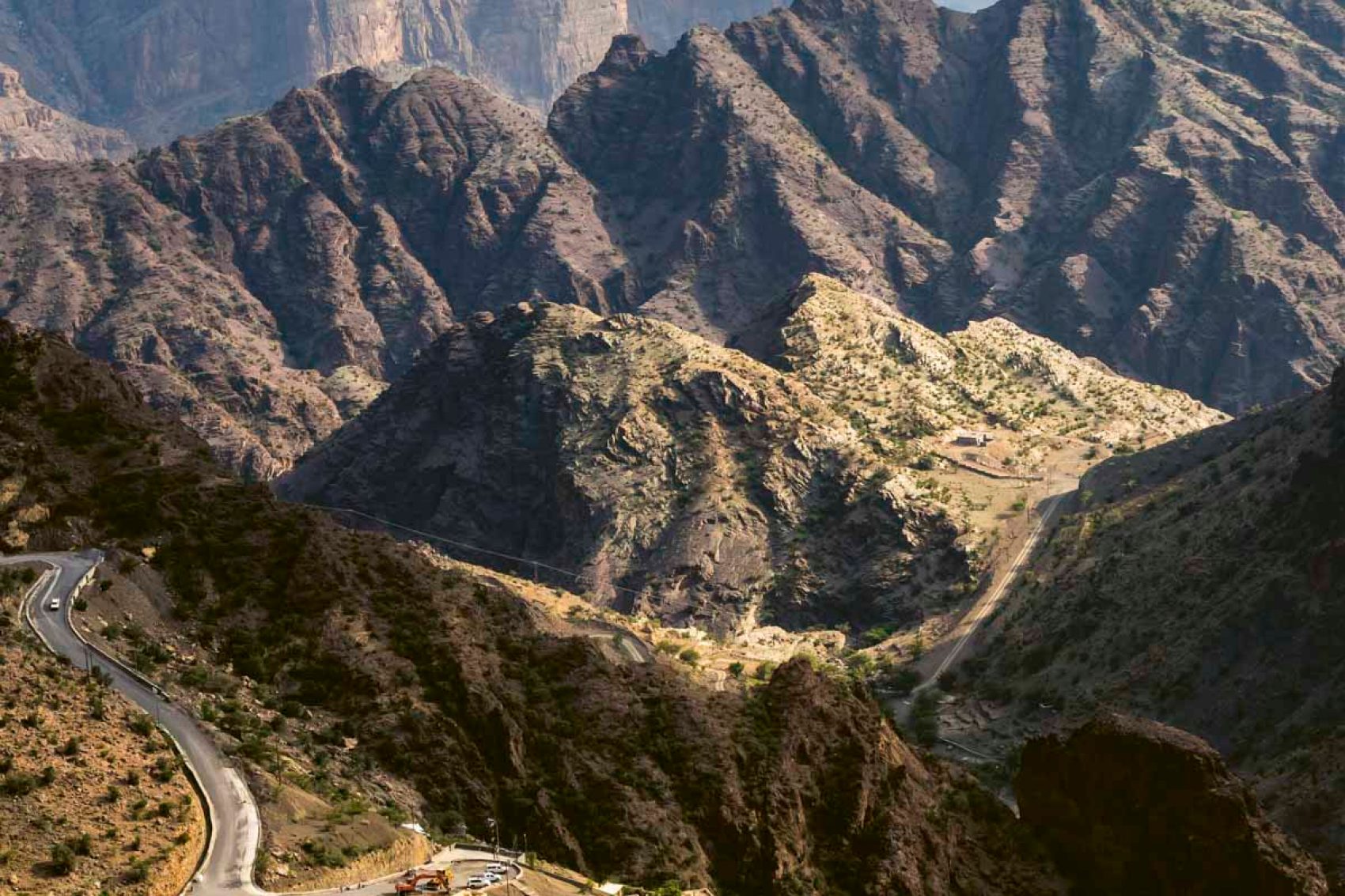 Beautiful road within mountains in the sun
