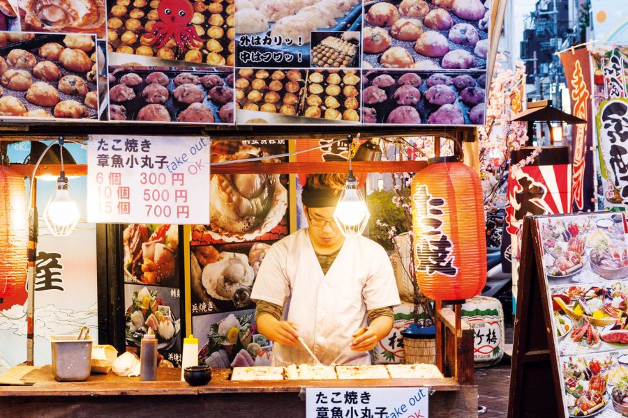 A takoyaki (battered octopus balls) stall in Osaka. Credit: Malcolm Fairman / Alamy Stock Photo / Argusphoto  