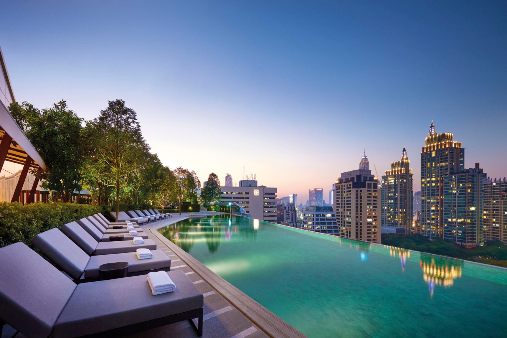 Rooftop infinity pool over Bangkok's buildings 