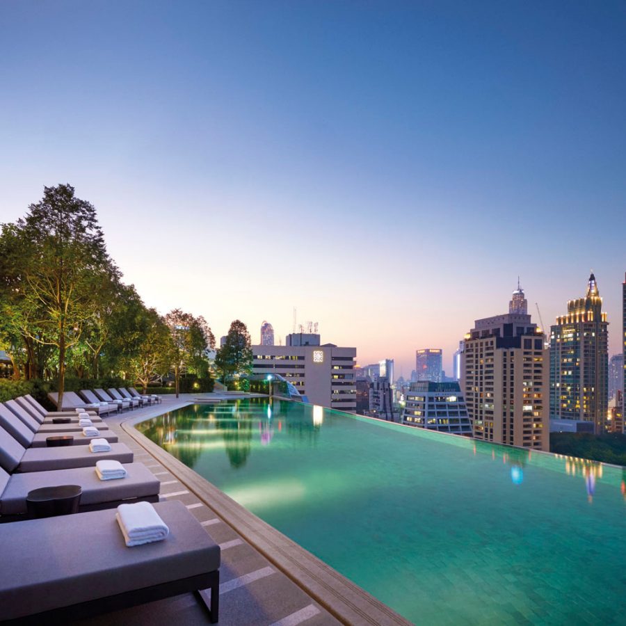 Rooftop infinity pool over Bangkok's buildings 