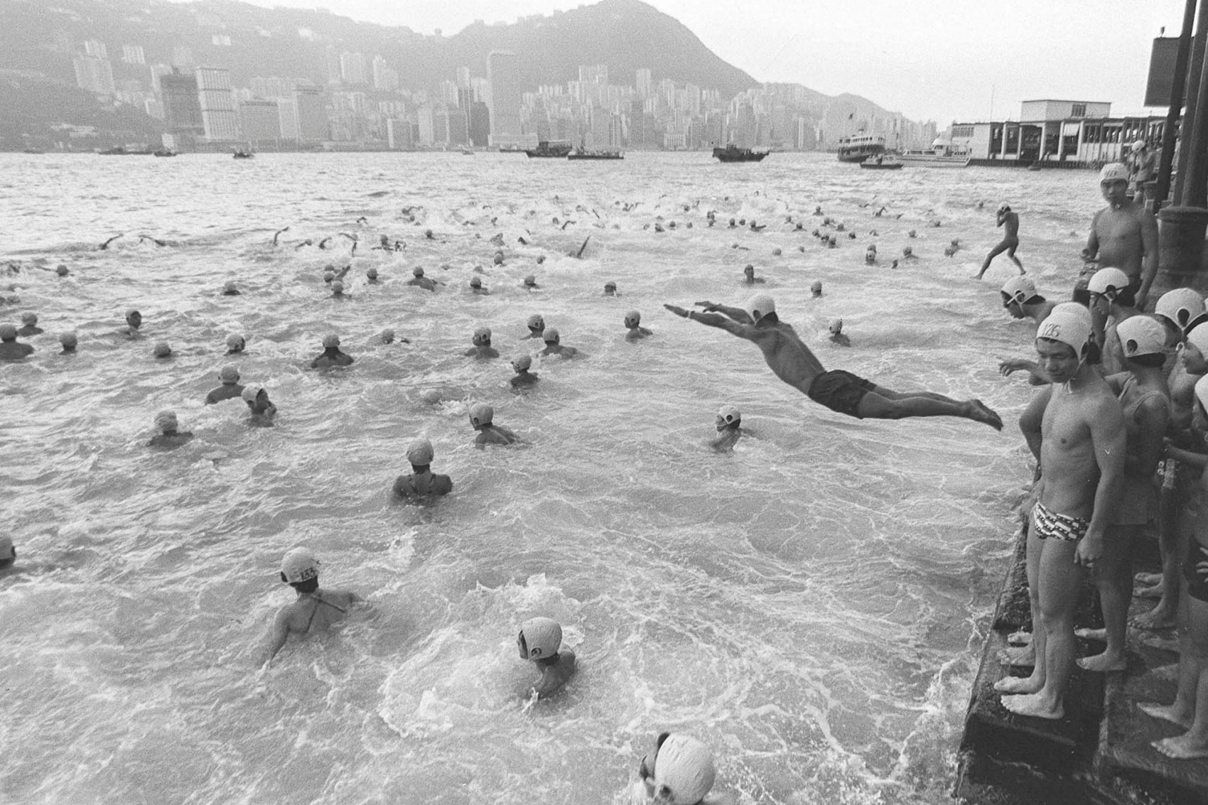 Hongkongers jump into Victoria Harbour for the 66th annual cross-harbour swim, 15 October 1978. Credit: C. Y. Yu / SCMP