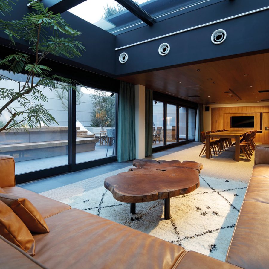 A glass and wooden hotel interior