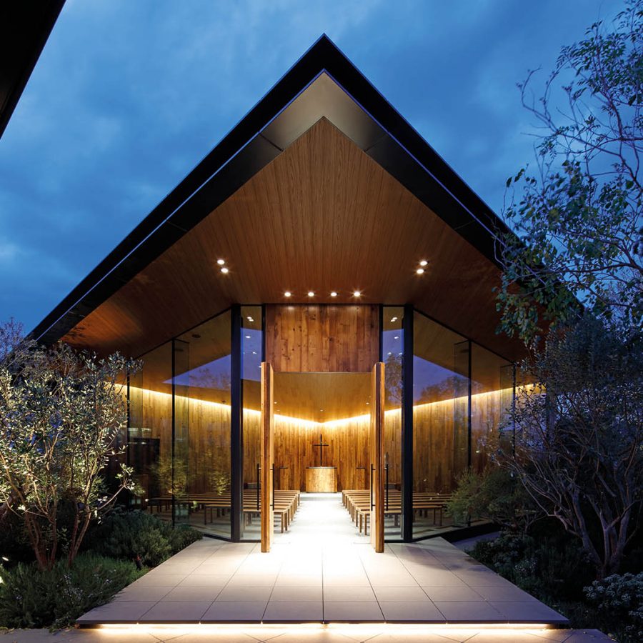 A glass-walled rooftop wedding chapel