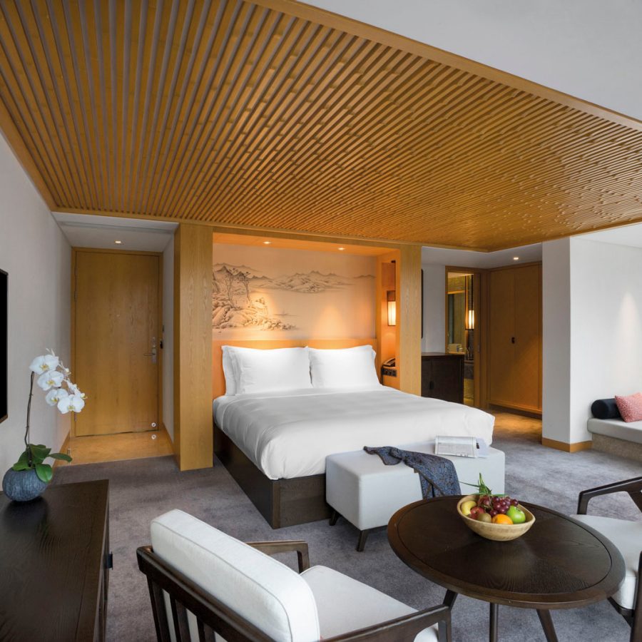 Spacious hotel room with warm lighting