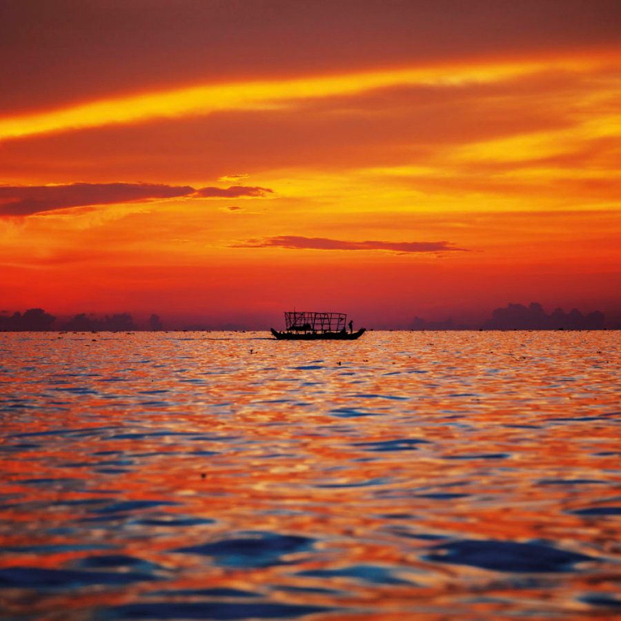 Boat on the ocean at sunset