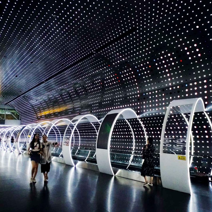 People along the time-space tunnel inside the Guangzhou Baiyun International Airport in Guangzhou (Greater Bay Area)