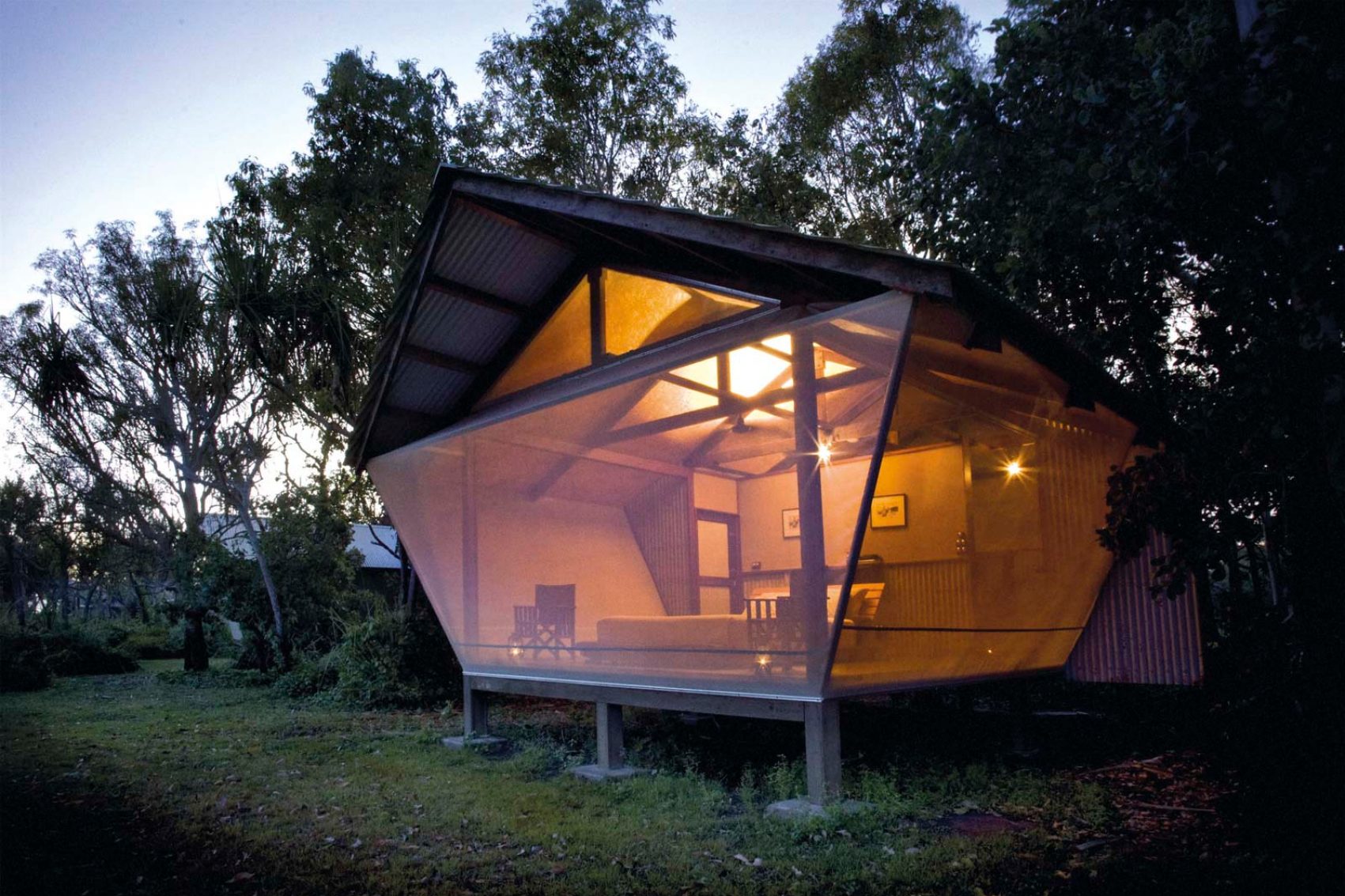 High glass window lodge at dusk. Credit: Archi Sartracom