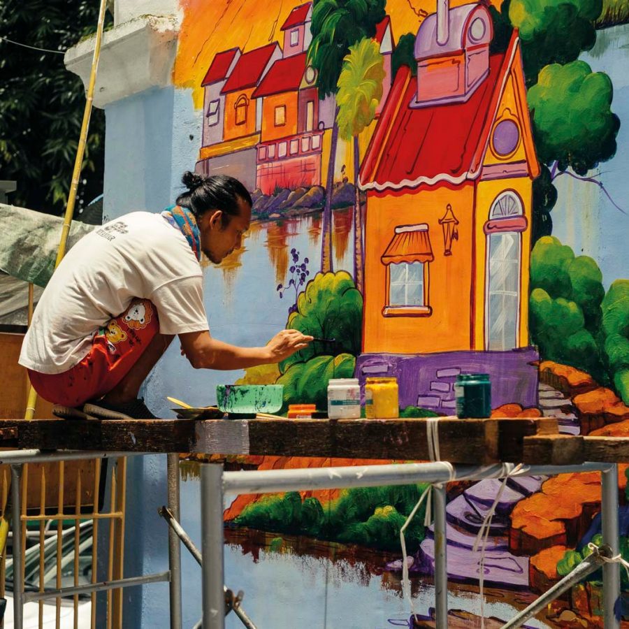 Man painting on wall