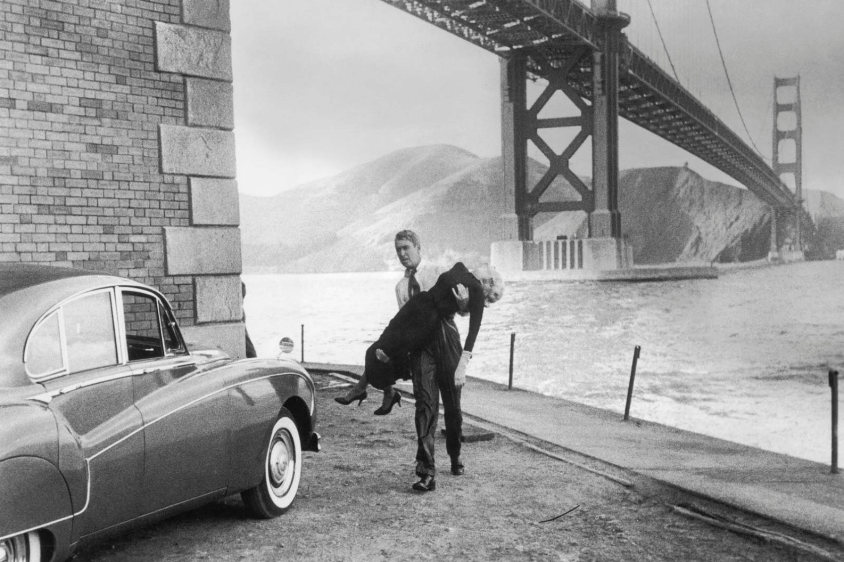 Black and white movie scene under Golden Gate Bridge