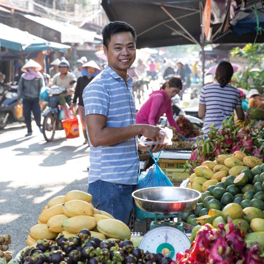Man at fruit market. Credit: Cedric Arnold