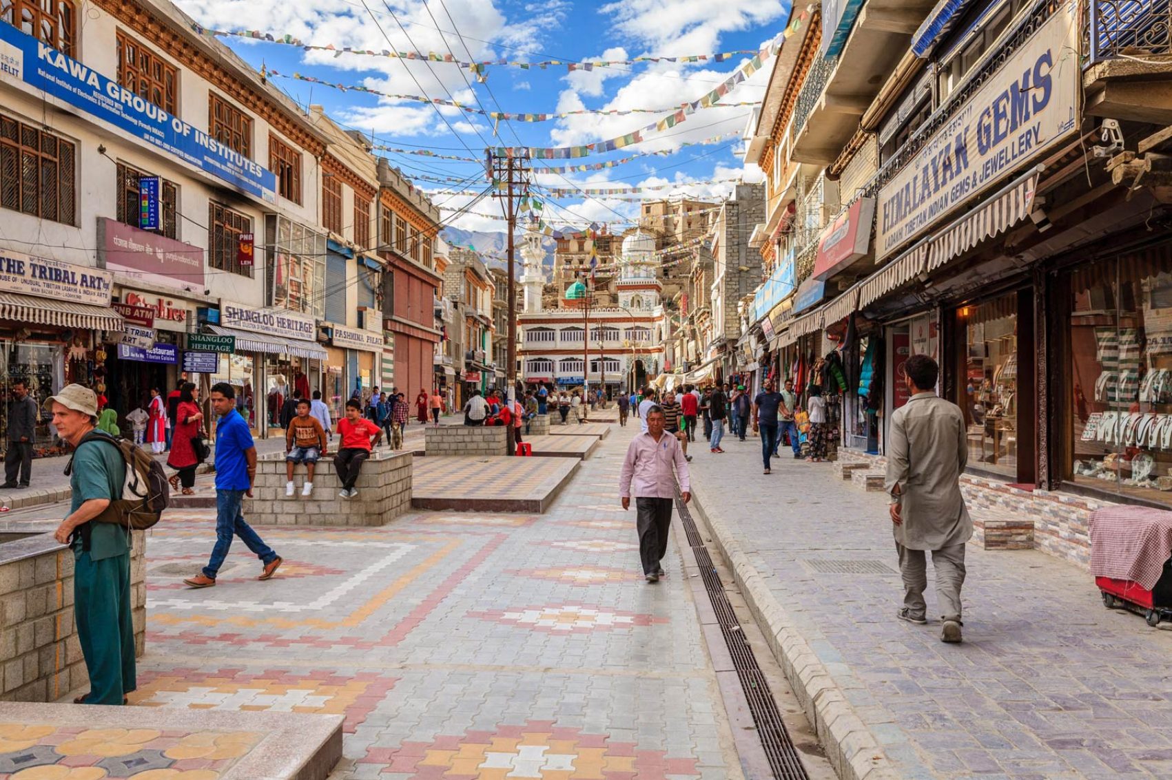 People walking through a street in India