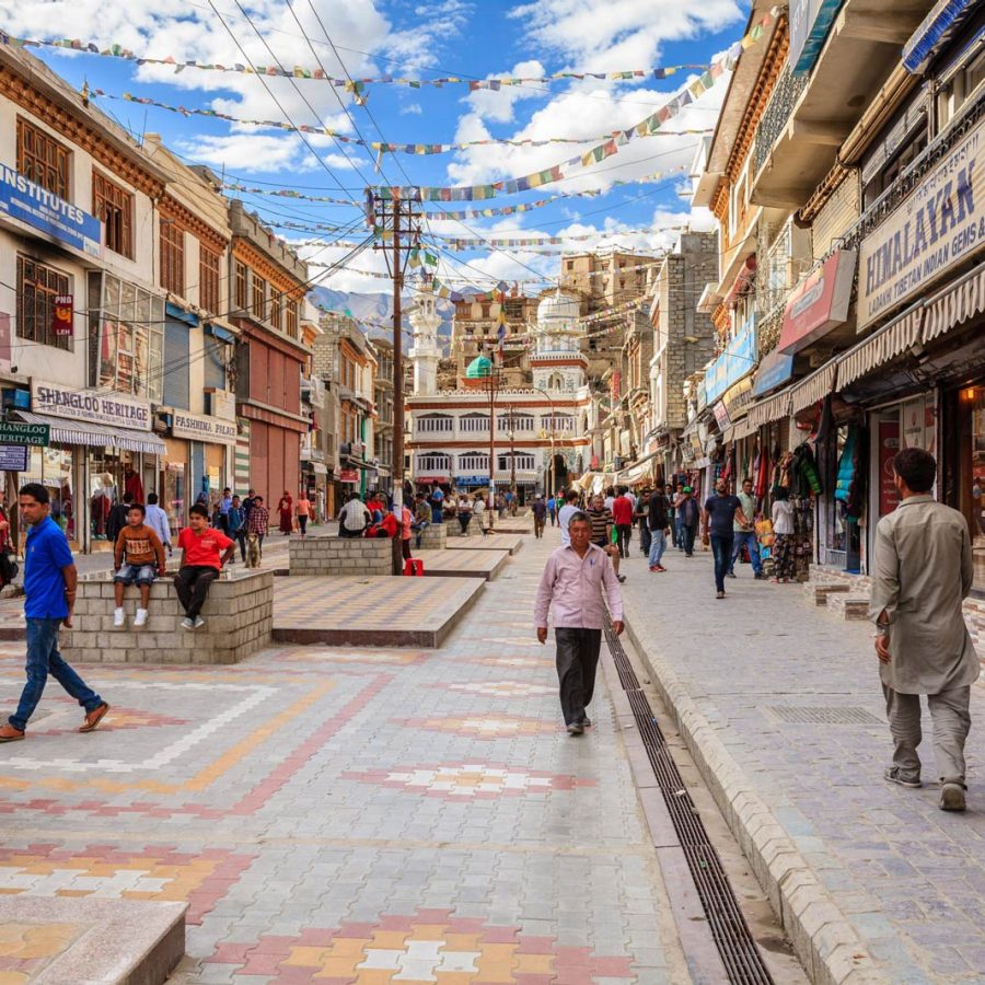People walking through a street in India