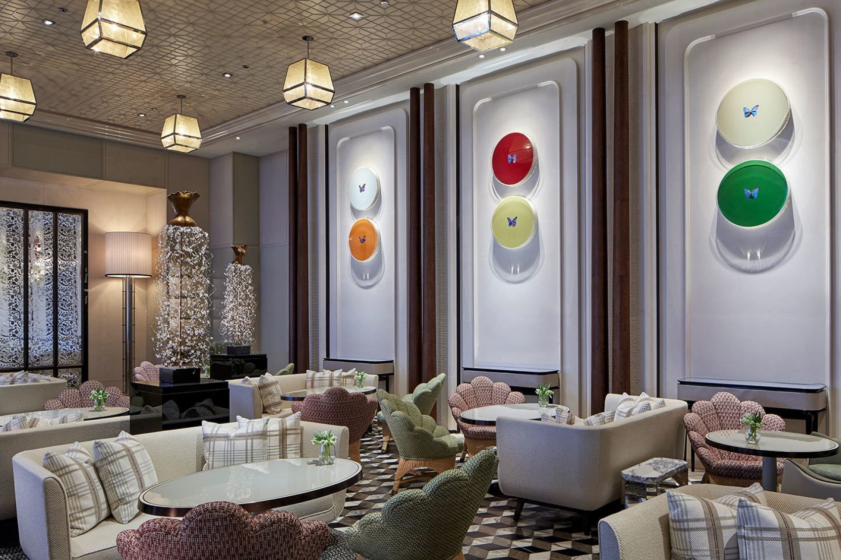 the Rosewood Hong Kong’s Butterfly Room, a cheerful, modern lounge decorated with Damien Hirst butterfly artwork