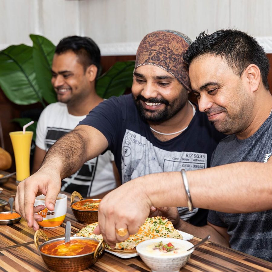Men enjoying a meal