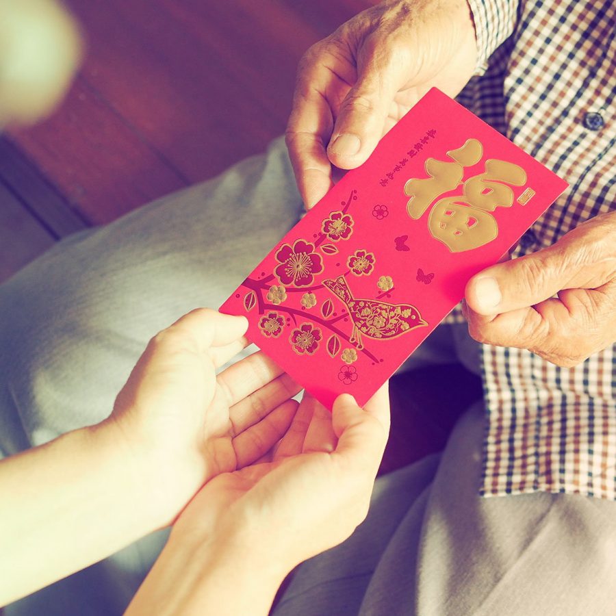 Handing over lai see for Chinese New Year. Credit: Shutterstock