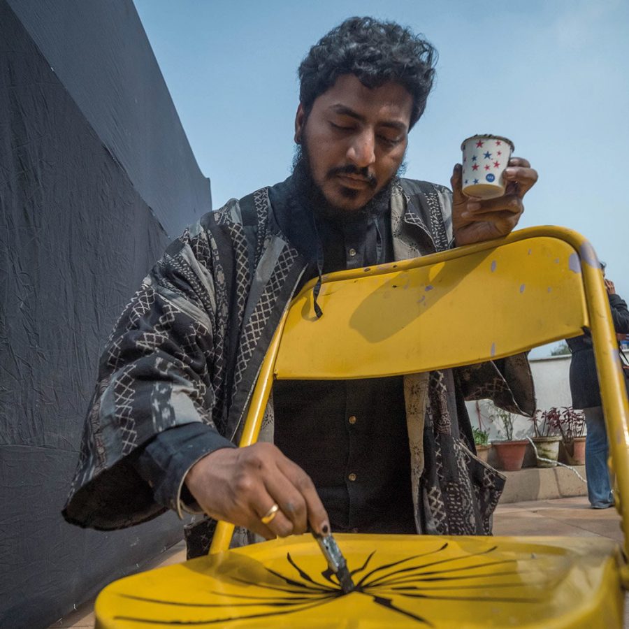 Man painting a chair