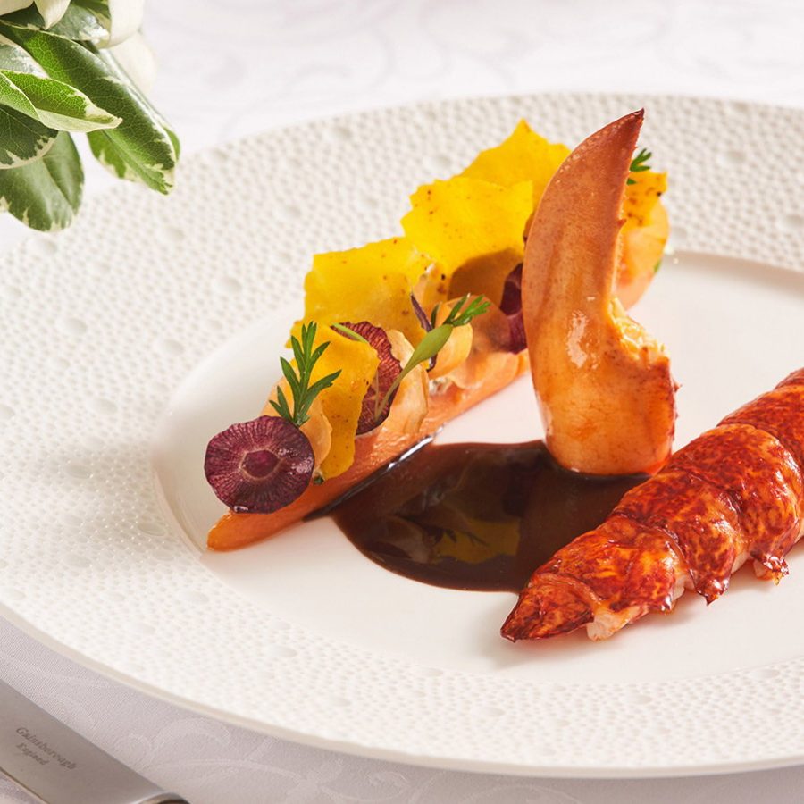 Gaddi's signature poached lobster with red wine sauce, carrots and smoked ricotta