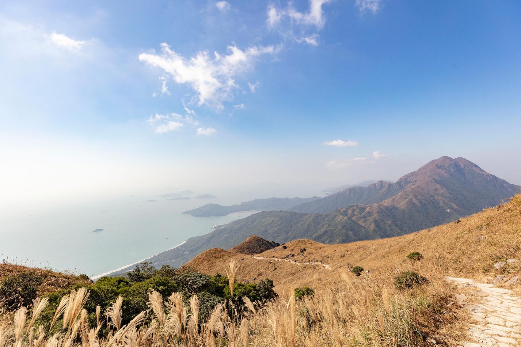 A landscape view of green hills and sea in Lantau Island, Hong Kong