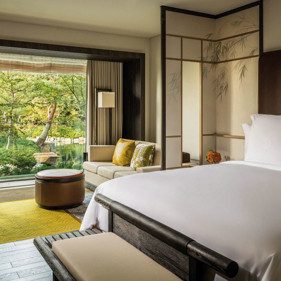 Hotel room opening up to greenery