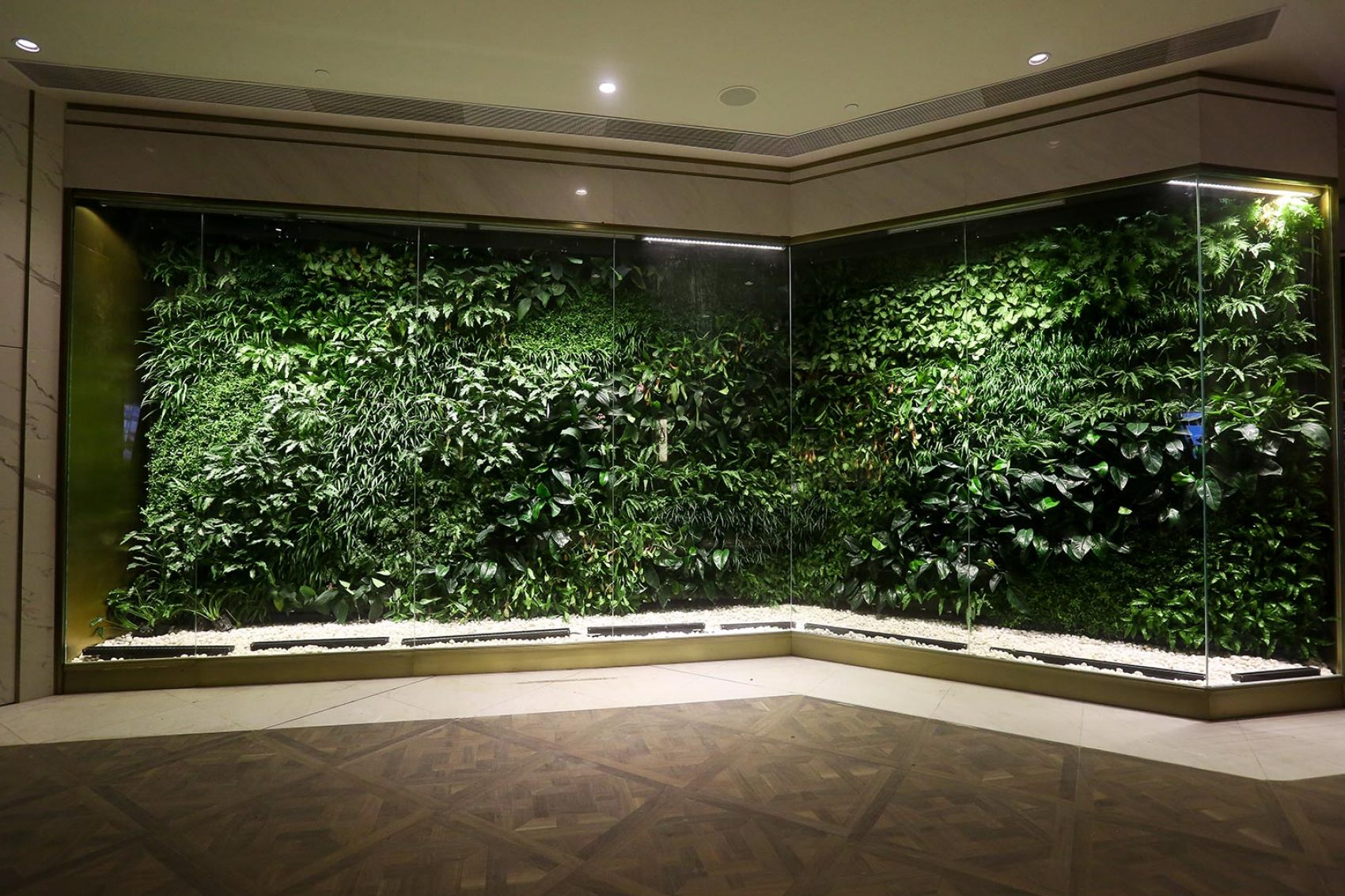 One of the green walls that carpet K11 Musea’s interiors in Hong Kong