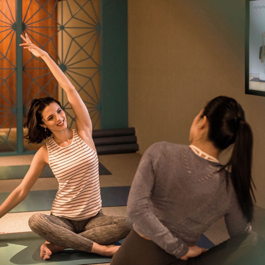 2 ladies practicing yoga 