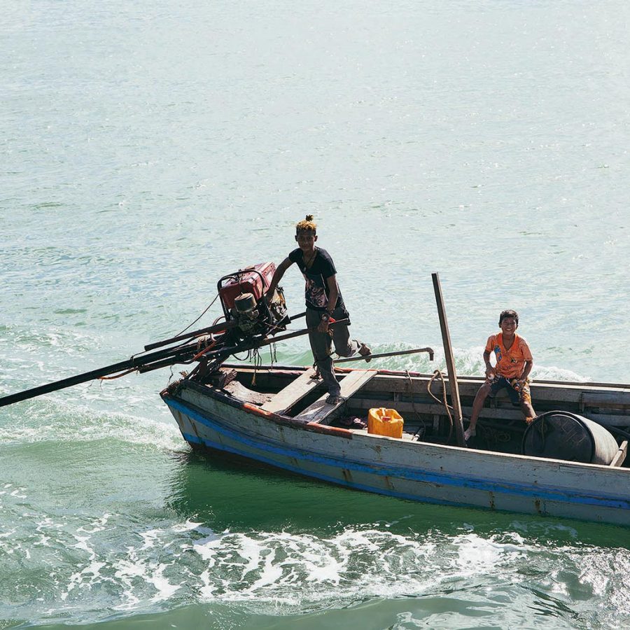 Man and boy smiling on a canoe